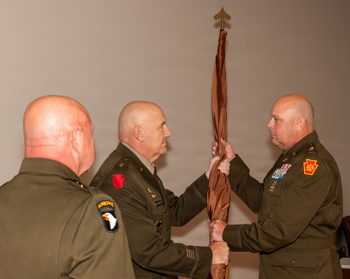 Military ceremony with three uniformed men. Military ceremony with three uniformed men.